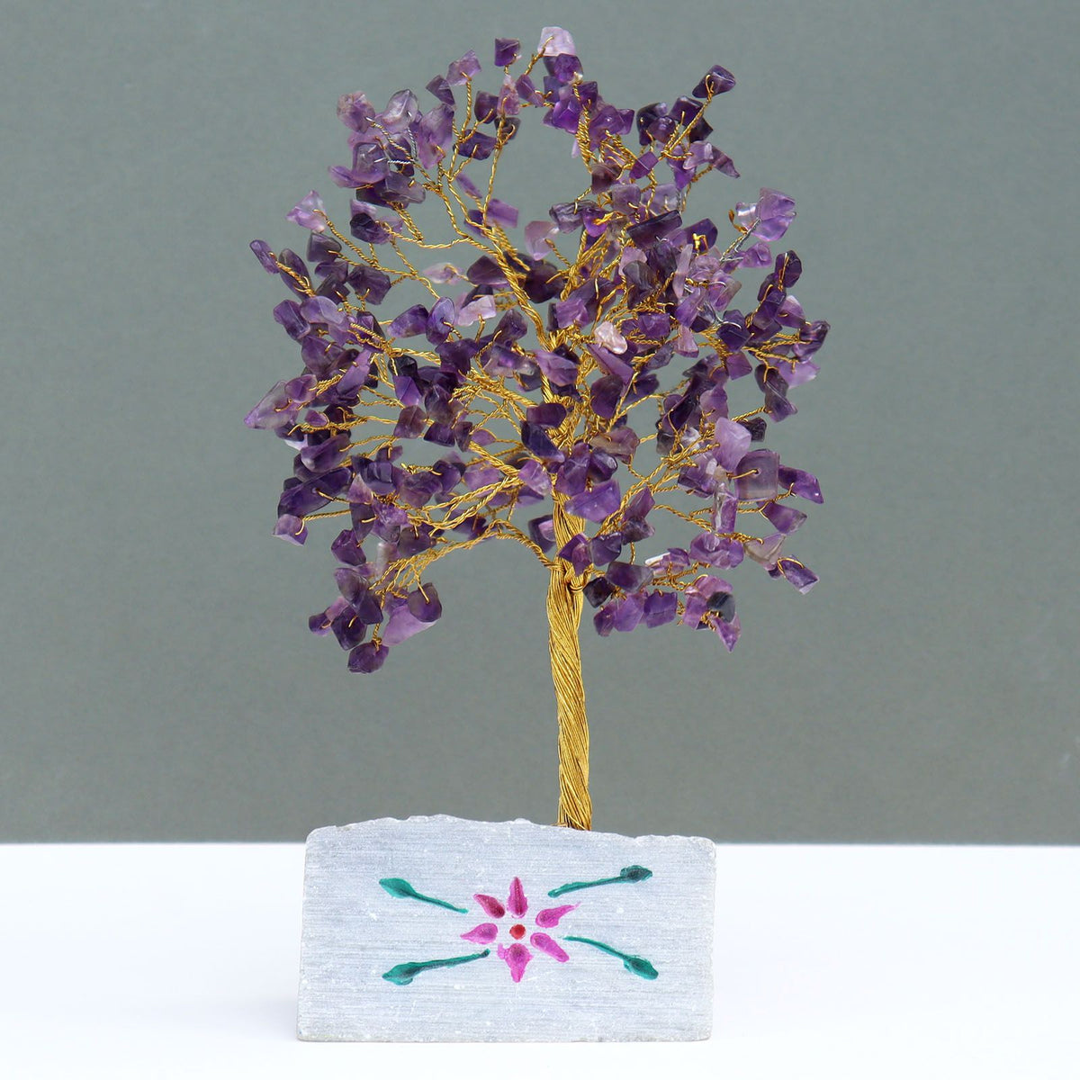 Small amethyst chipstone tree on a hand-painted stone base, on rumpled linen - view 3