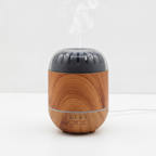 Copenhagen wood-effect aroma diffuser on a clean white surface against a white wall