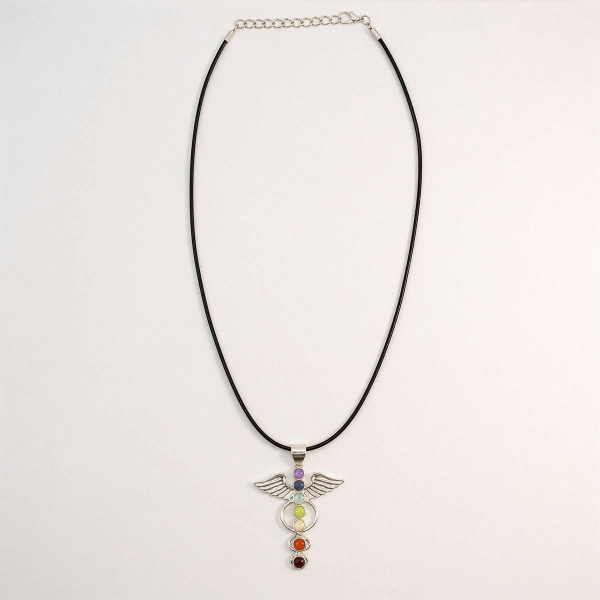 Angel wing pendant with seven chakra stones on a black cord with an adjustable chain