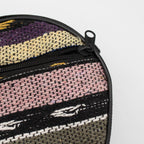 Close-up of the woven carry bag fabric and zip on the medium Atlas tongue drum