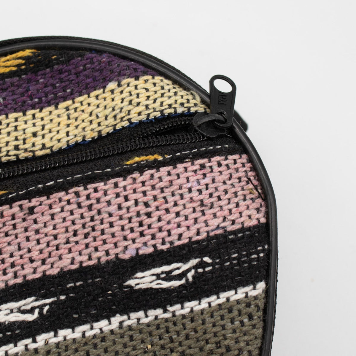 Close-up of the woven carry bag fabric and zip on the medium Atlas tongue drum