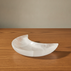 Crescent moon dish carved from white Moroccan selenite