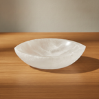 Pointed oval selenite bowl, polished inside with a raw white rim