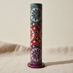 Soapstone round tower incense holder with sun motifs on natural linen