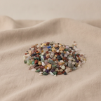 Mixed natural gemstone tumbled chips on natural linen