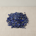 Lapis lazuli gemstone chips on cotton canvas