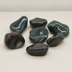 Extra large bloodstone tumble stones on cotton canvas