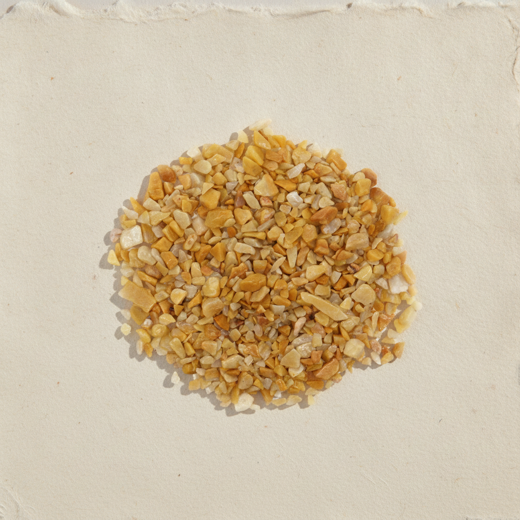 Golden quartz gemstone chips on cotton rag paper