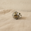Silver angel bell pendant Romance with green stone on natural linen