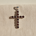 Garnet crucifix pendant on natural linen