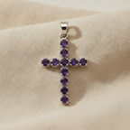 Amethyst coloured crucifix pendant on natural linen