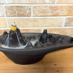 Mountain scape backflow incense burner with smoke running down the slopes - view 2