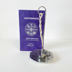 Astamangal rope incense burner standing in front of its purple gift box