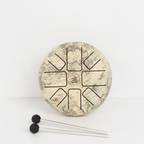 Medium Atlas steel tongue drum from above with two rubber mallets