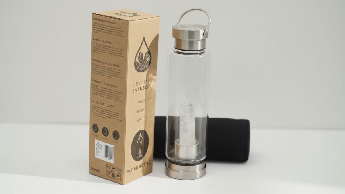 Video of the clear quartz crystal glass water bottle with its box and padded sleeve, with the camera slowly moving in