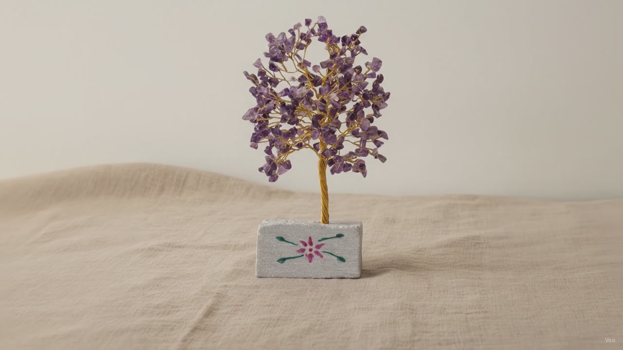Small amethyst chipstone tree on a hand-painted stone base, on rumpled linen video