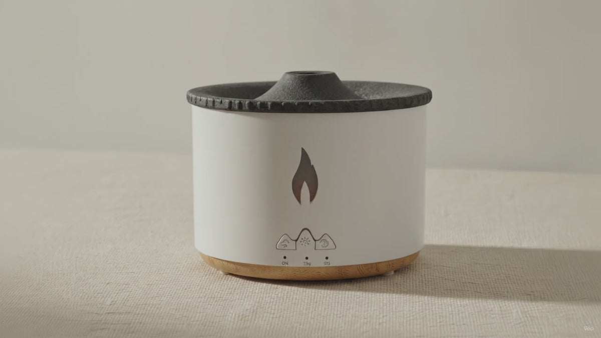 White volcano flame aroma diffuser with a textured dark lid, on cotton canvas video