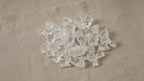 Small apophyllite raw crystal points on natural linen