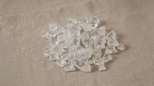 Small apophyllite raw crystal points on natural linen