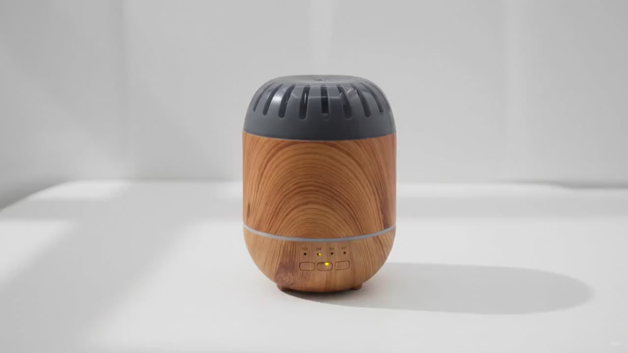 Video of the Copenhagen wood-effect aroma diffuser with a soft wisp of cool mist, the camera slowly moving in