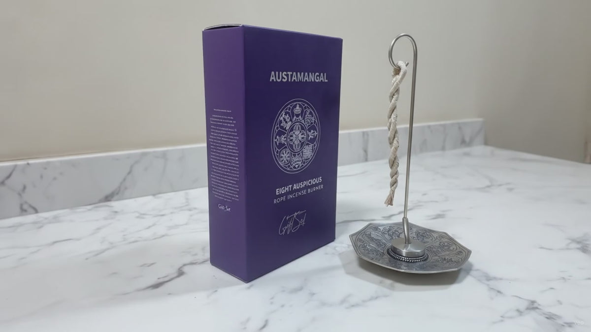 Astamangal rope incense burner, silver plated octagonal dish with hook stand, beside its gift box on marble