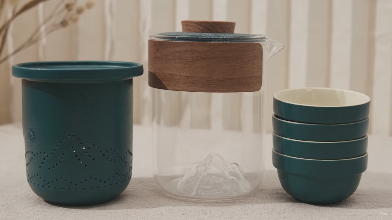 Teal and glass travel tea set with teapot, infuser and four stacking cups video