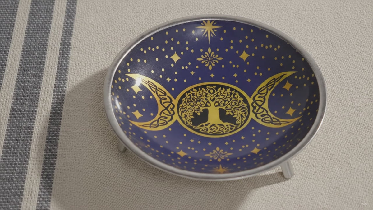 Triple Moon offering dish on three legs, slow zoom