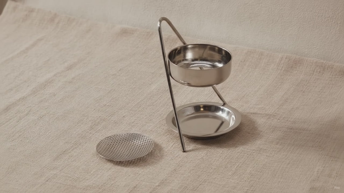 Plated brass incense warmer with mesh dish and tealight tray, on rumpled linen video