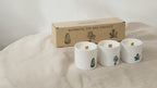 Set of three Marsh Viola scented soy candles with gift box on natural linen