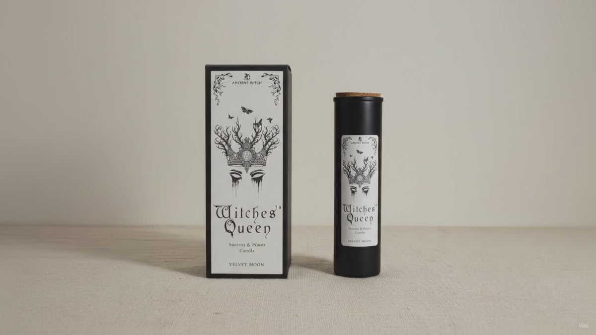 Black Witches' Queen candle tube beside its illustrated box, on cotton canvas video