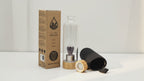 Amethyst angel crystal water bottle with bamboo lid, box and padded sleeve, soft light moving across the wall