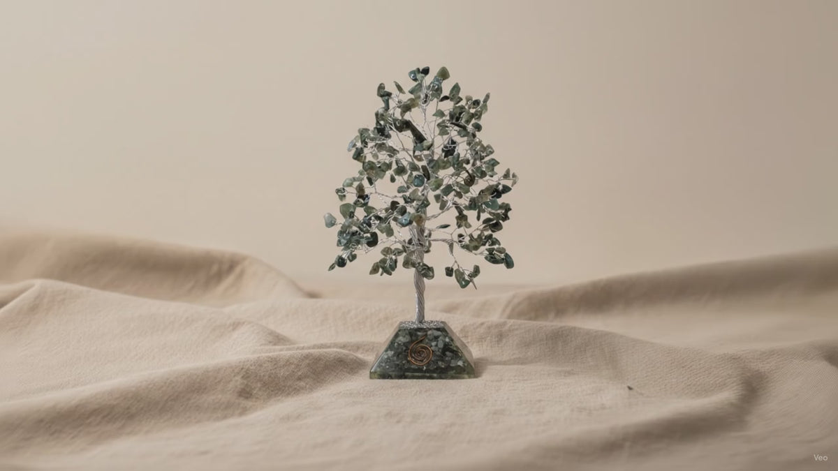 Moss agate chipstone tree on a speckled orgonite base, on rumpled linen video
