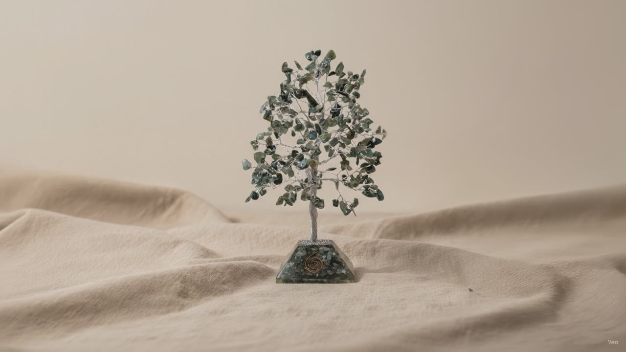 Moss agate chipstone tree on a speckled orgonite base, on rumpled linen video