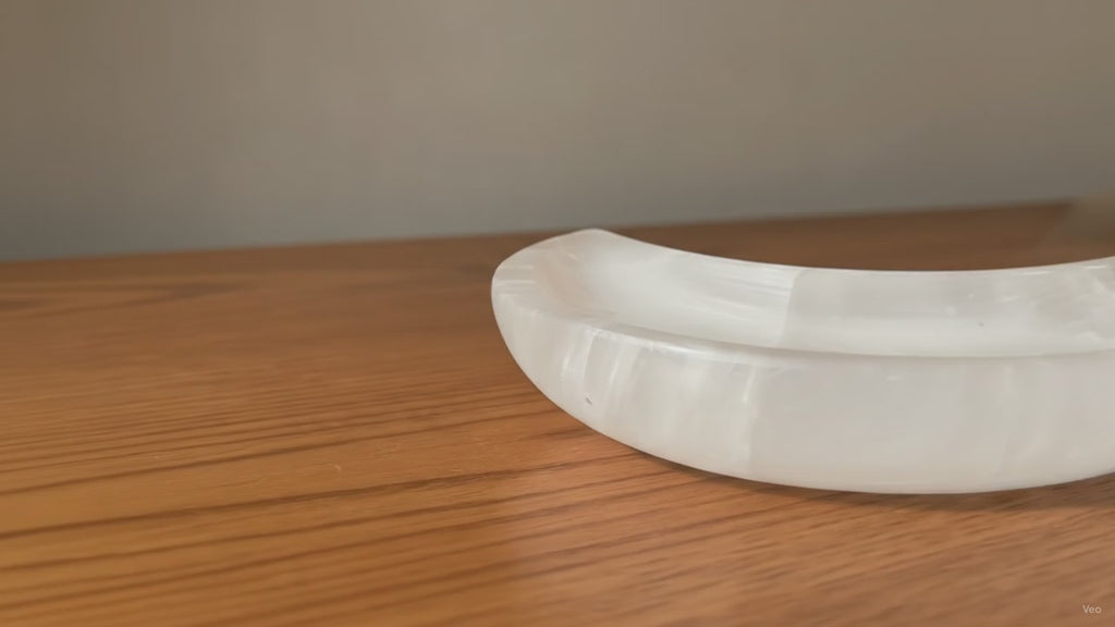 Crescent moon dish carved from white Moroccan selenite - video