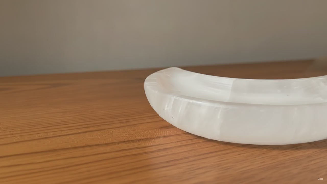 Crescent moon dish carved from white Moroccan selenite - video