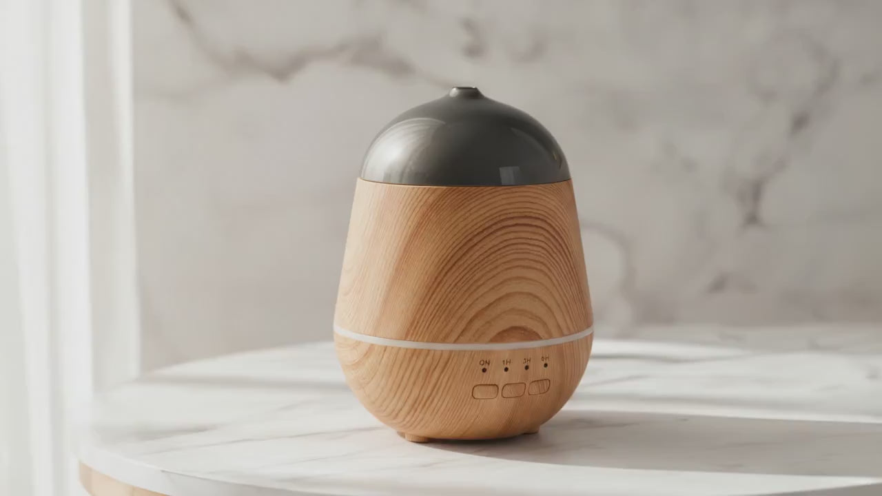 Marseille wood-effect aroma diffuser on a marble table, slow product video