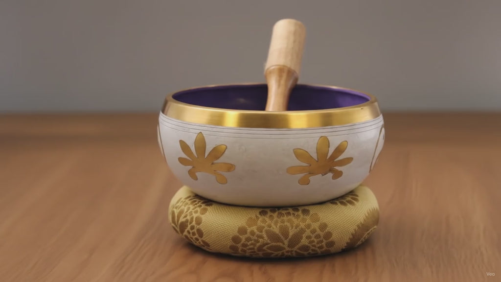 Large white and purple Yin and Yang singing bowl set with cushion and striker on oak, slow push-in