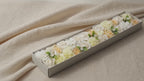 Long box of white and ivory soap roses lying open on cotton canvas video