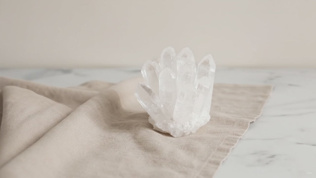 Crafted clear quartz crystal cluster on natural linen