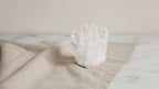 Crafted clear quartz crystal cluster on natural linen
