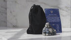 Que Sera stone Buddha with velvet pouch and card, slow product video