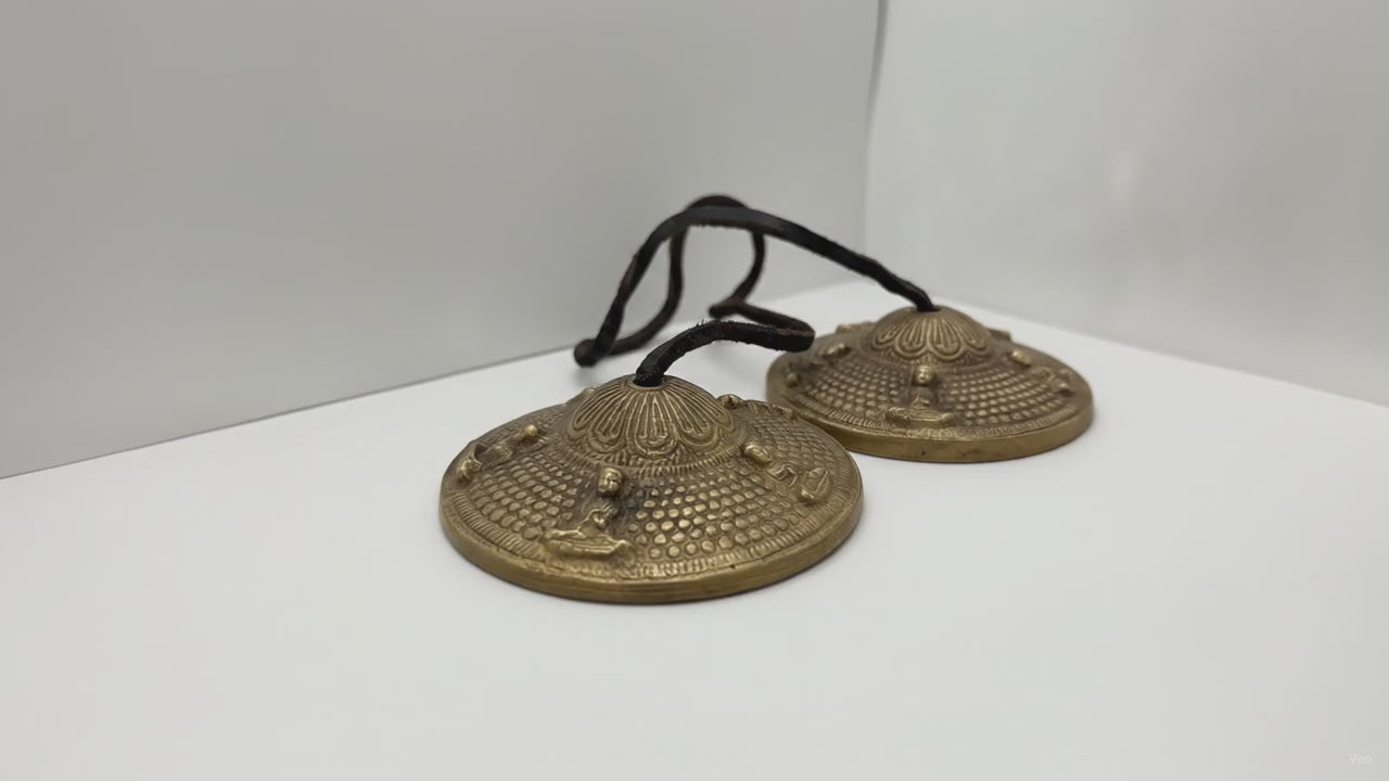 Tibetan tingsha bells with five Buddhas, slow product video