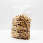 First grade palo santo wood sticks on a clean white surface against a white wall