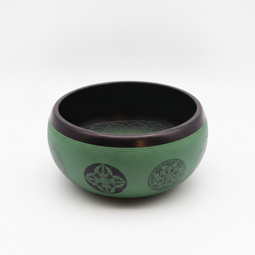 Earth powder singing bowl with mandala buddha on a clean white surface against a white wall
