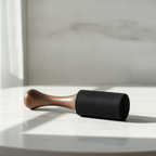Large wooden king stick striker lying on a marble table