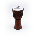 Large freedom rhythm djembe drum on a clean white surface against a white wall