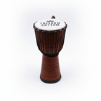 Large freedom rhythm djembe drum on a clean white surface against a white wall