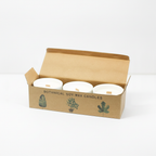 Set of 3 marsh viola botanical candles on a clean white surface against a white wall