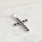 Silver-plated crucifix pendant set with deep purple stones, on linen - view 2