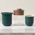 Teal and glass travel tea set with teapot, infuser and four stacking cups
